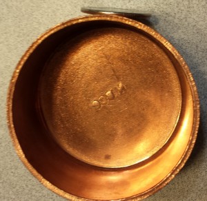 2" copper endcap, next to a quarter for thickness comparison.